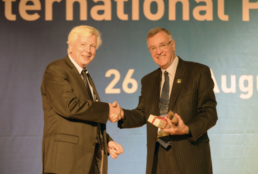 Peter McDonald presenting the 2013 IUSSP Laureate Award to John Bongaarts.